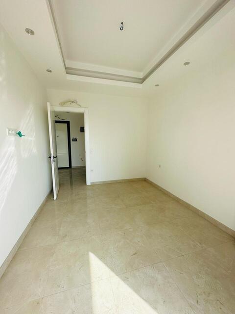 Продажа двухкомнатной квартиры 1+1 в Махмутларе, Алания, в комплексе Yekta Trade Center - Фото 22