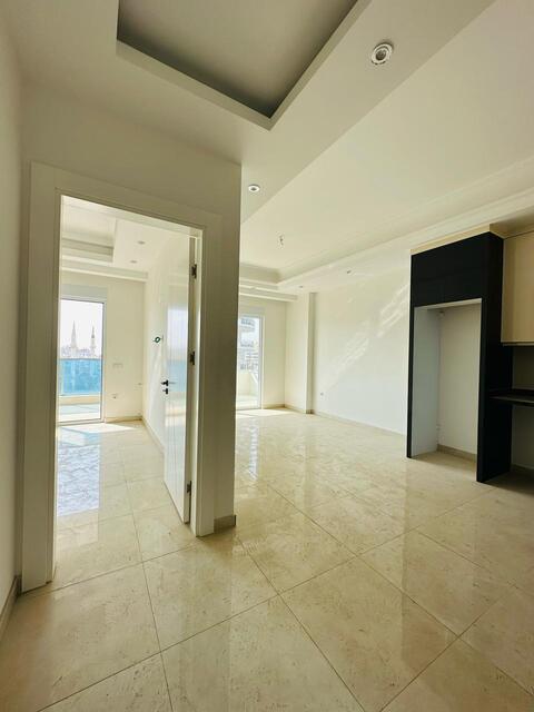 Продажа двухкомнатной квартиры 1+1 в Махмутларе, Алания, в комплексе Yekta Trade Center - Фото 23