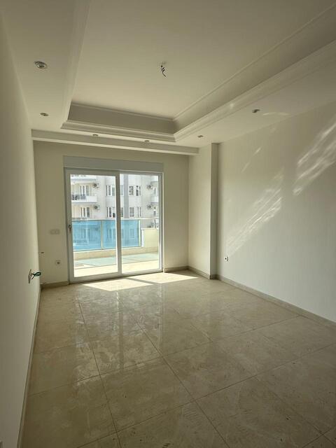 Продажа двухкомнатной квартиры 1+1 в Махмутларе, Алания, в комплексе Yekta Trade Center - Фото 24