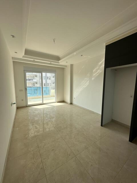 Продажа двухкомнатной квартиры 1+1 в Махмутларе, Алания, в комплексе Yekta Trade Center - Фото 25