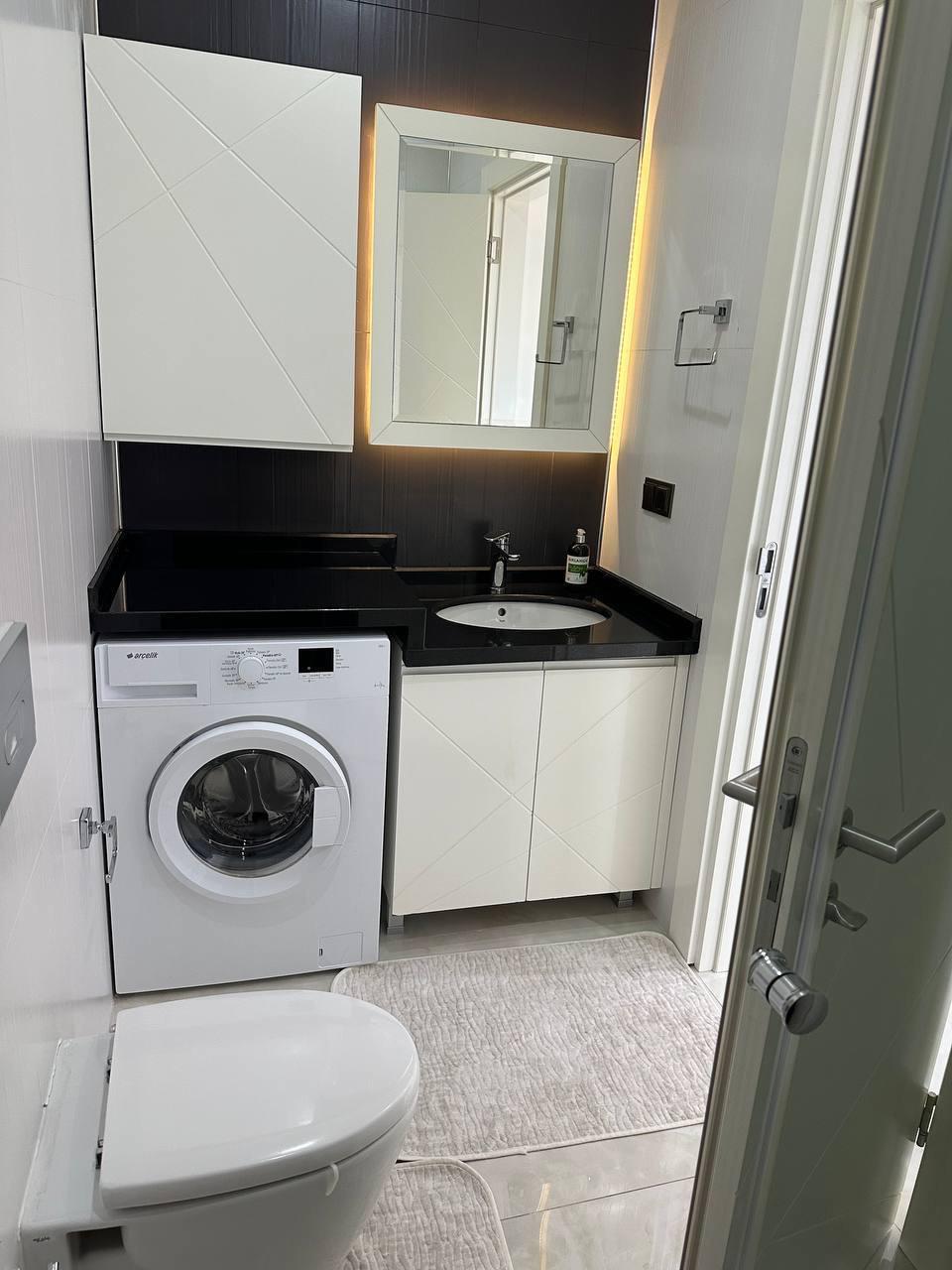 Квартира 1+1 в комплексе Konak Seaside Tower — первая береговая линия, вид на море - Фото 1