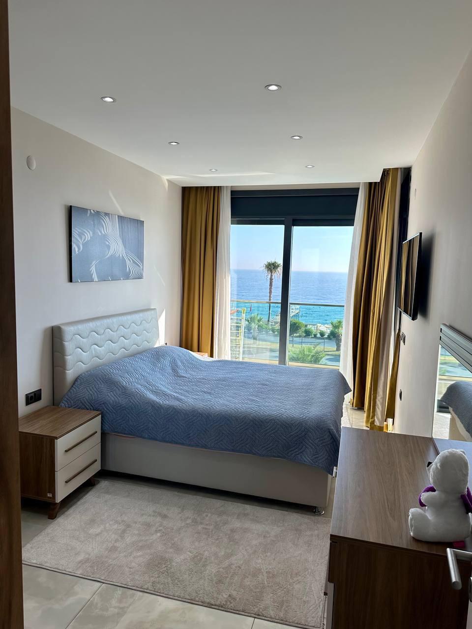 Квартира 1+1 в комплексе Konak Seaside Tower — первая береговая линия, вид на море - Фото 6