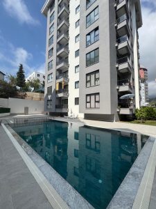 Квартира в Алании 1+1 в комплексе Hakyuz Life 3 в районе Махмутлар - Фото 1