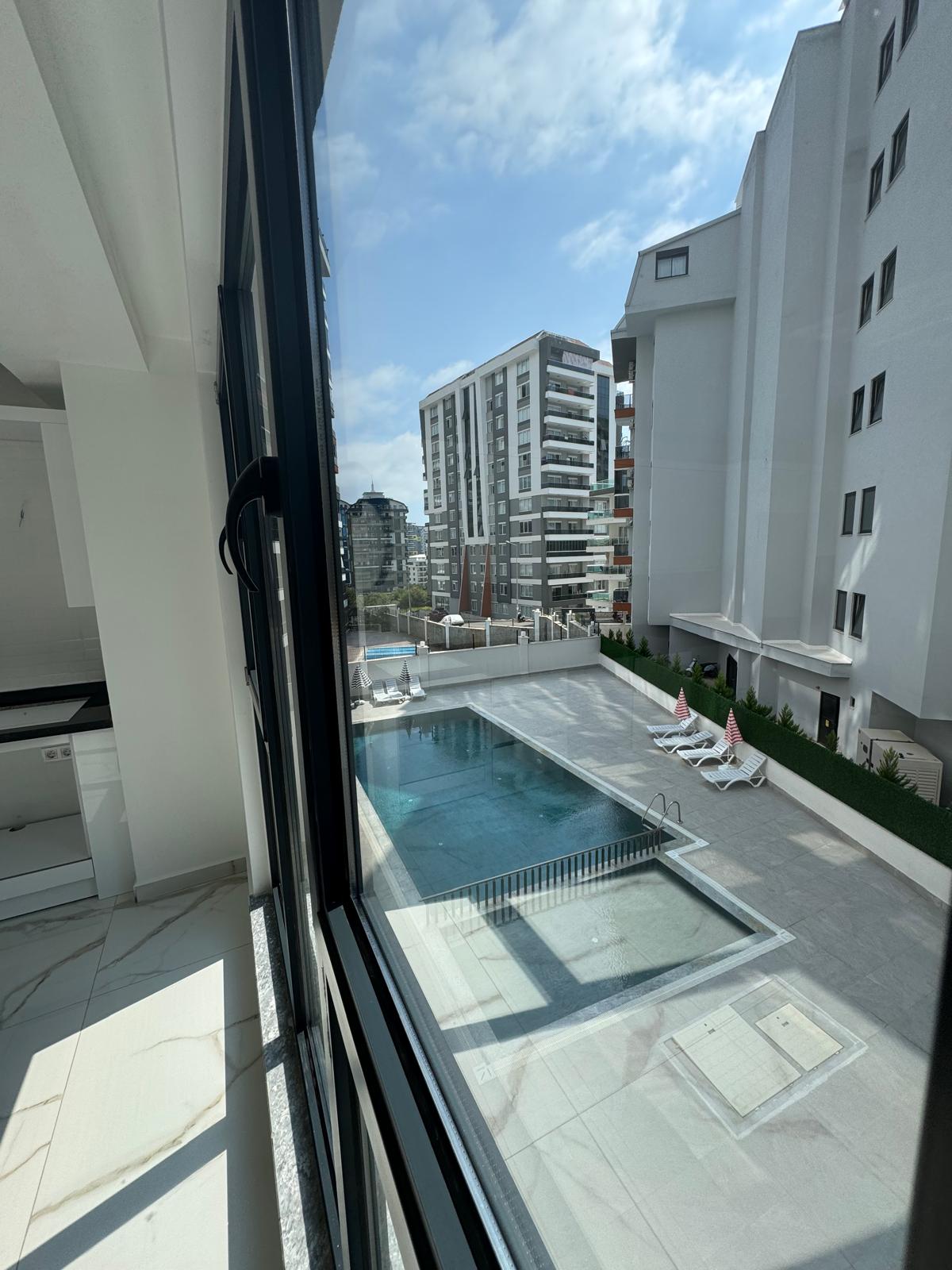 Квартира в Алании 1+1 в комплексе Hakyuz Life 3 в районе Махмутлар - Фото 23