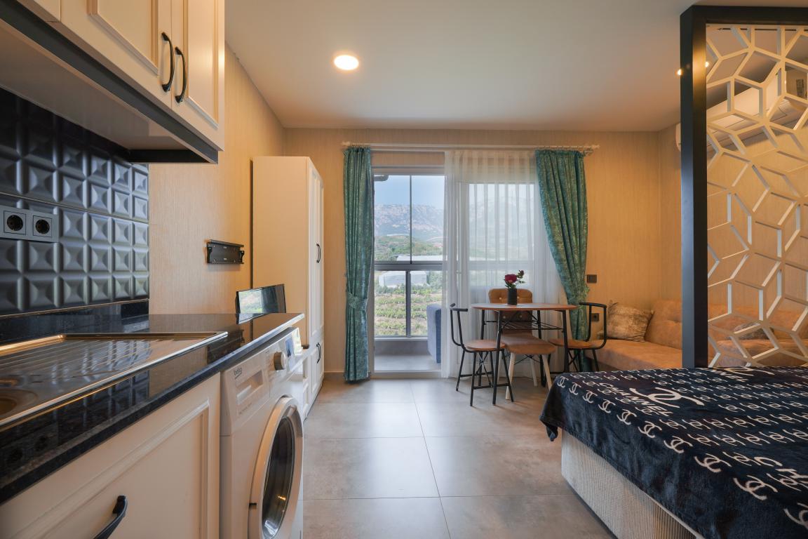 Квартира в Алании 1+0 по выгодной цене в комплексе Stay Suite в районе Каргыджак в Турции - Фото 12