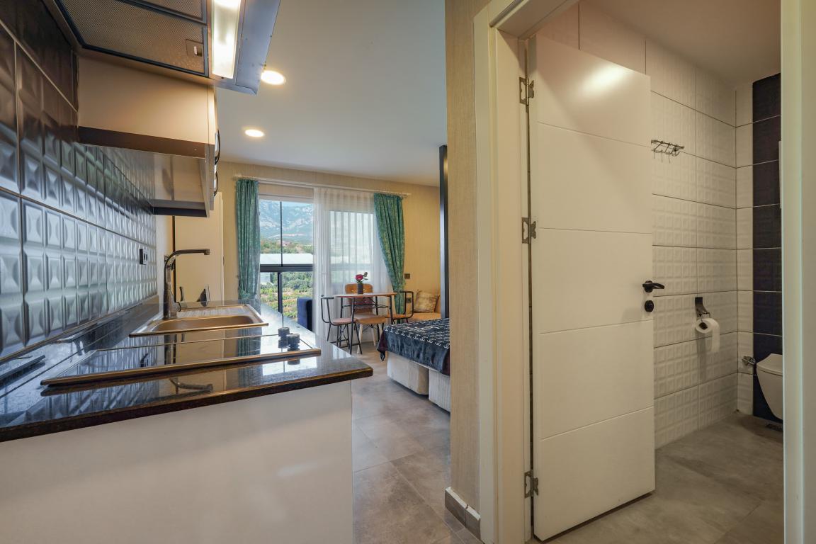 Квартира в Алании 1+0 по выгодной цене в комплексе Stay Suite в районе Каргыджак в Турции - Фото 14