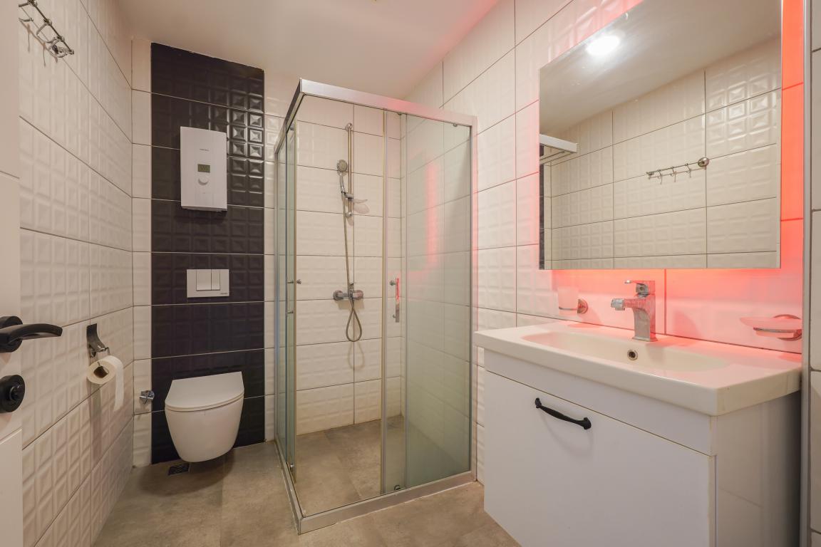 Квартира в Алании 1+0 по выгодной цене в комплексе Stay Suite в районе Каргыджак в Турции - Фото 15