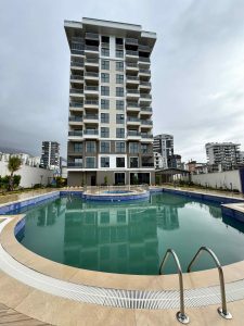 Квартира в Алании 2+1 по отличной цене в комплексе Travok Tower в районе Махмутлар - Фото 2
