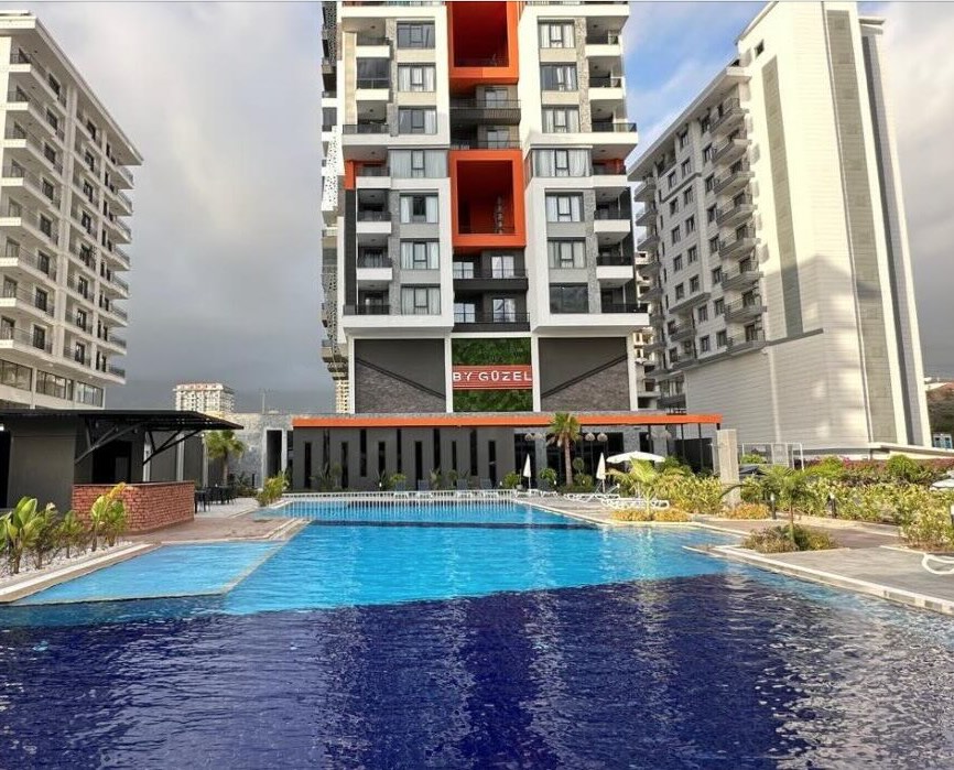 Квартира в Алании 2+1 в комплексе By Guzel 2000 в районе Махмутлар - Фото 1