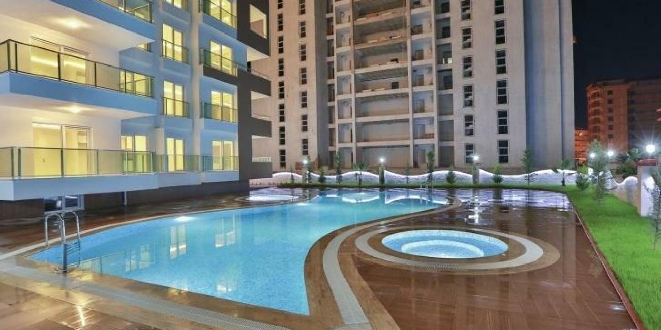 Квартира в Алании 1+1 в комплексе Bay 3 в районе Махмутлар - Фото 1