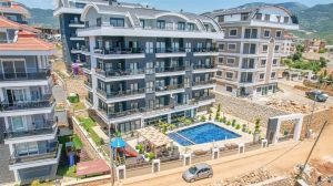 Недорогая квартира в Алании 1+1 United Suites - Фото 1